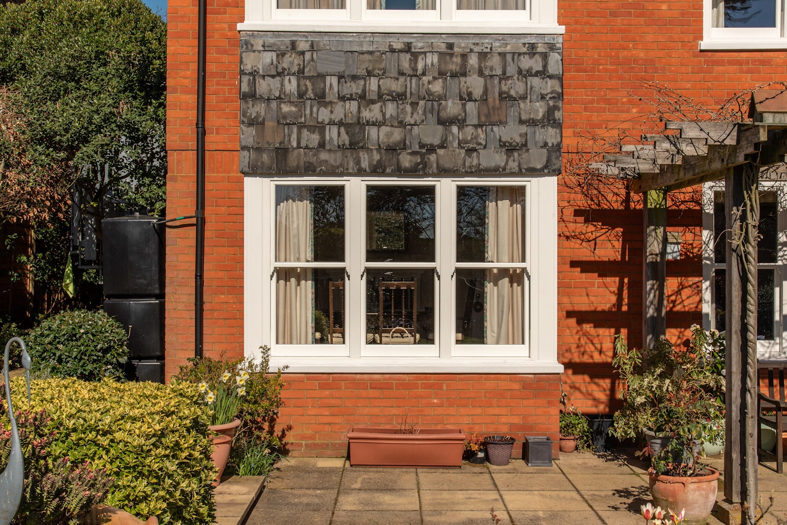 Bygone PVCu sash windows create a beautifully elegant bay for this Woodbridge home