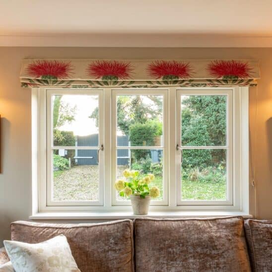 White Evolution timber alternative PVCu casement windows with a single horizontal glazing bar