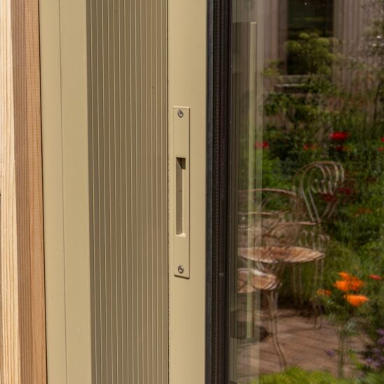 The external handle on our Sunflex SVG20 sliding door is designed to blend in, discreetly colour matched to the door and sunken into the frame, it allows the first pane to slide behind the next, offering flush stacking of the doors and an architectural clean line when the doors are open.