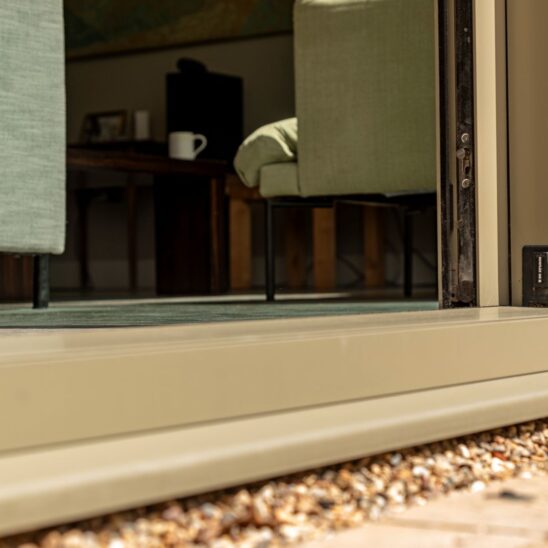 Our Sunflex SVG20 aluminium sliding doors offer a low threshhold to the garden beyond, whilst perfectly matching the height of the flooring inside, rendering the bottom of the frame almost invisible.