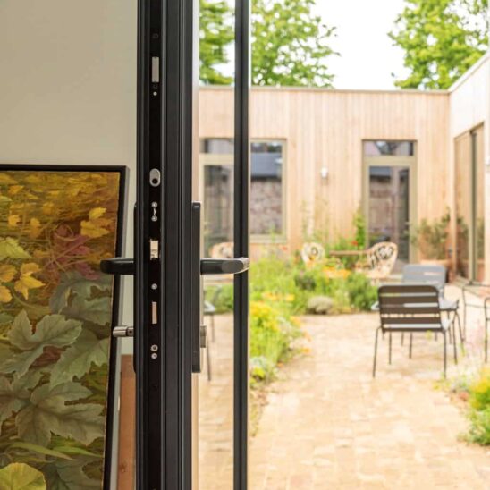 Sleek Sunflex colour matched Aluminium lever handle, with Secured by Design accredited multi point security locking