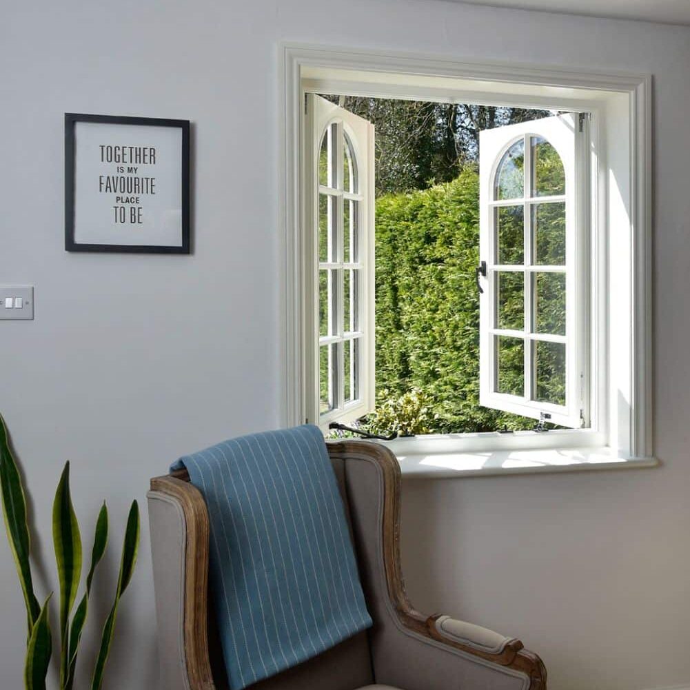 Cottage flush timber casement windows in off-white with 18mm astragal bars and true arch swept heads