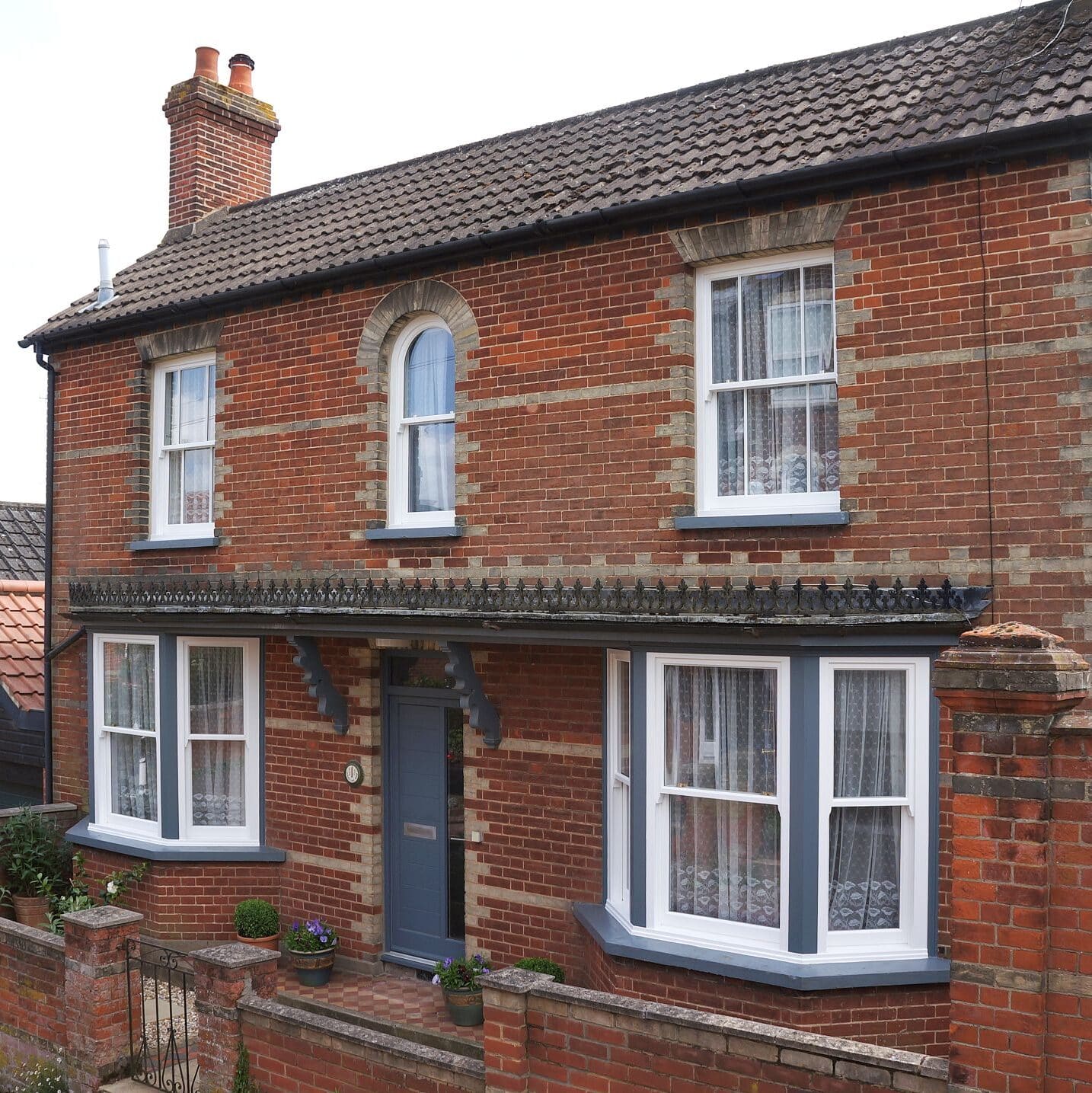 Traditional engineered timber sash windows with contemporary entrance door
