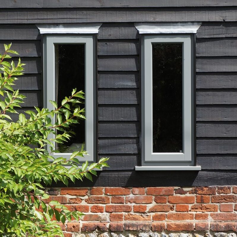 Contemporary Lipped Casement windows (StormProof Windows) in London Grey with stainless steel ironmongery