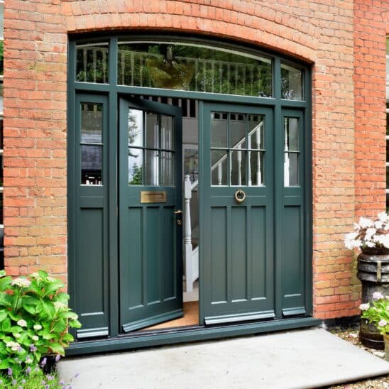 Timber Polstead double front door with sidelights and toplight, featuring 18mm astragal glazing bars and Samuel Heath antique brass unlaquered furniture.