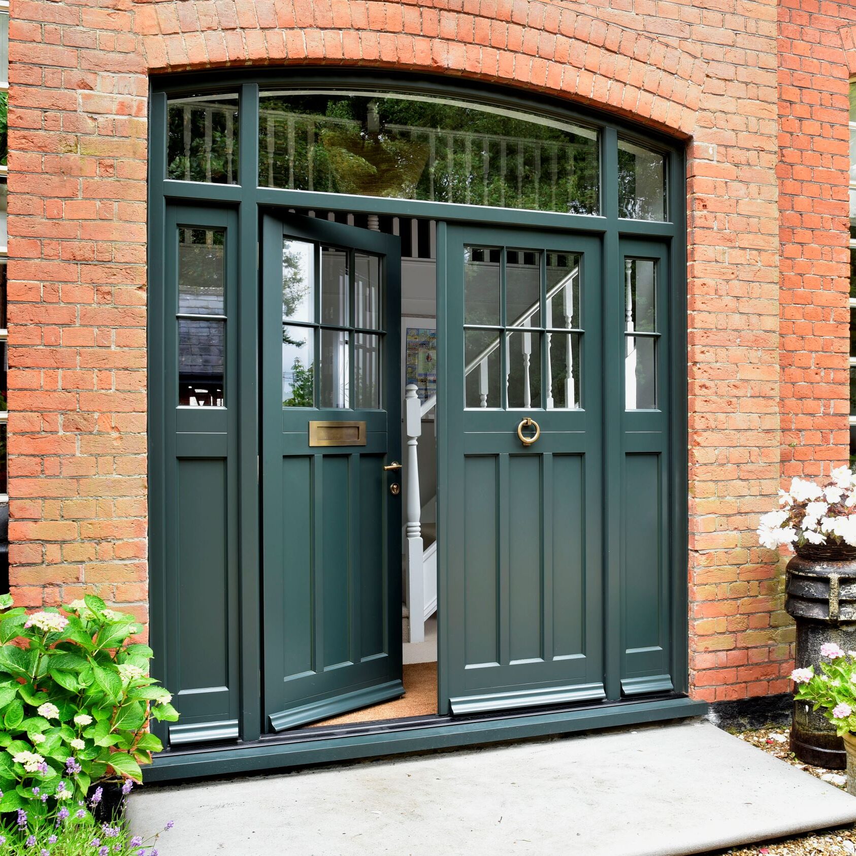 Timber Polstead double front door with sidelights and toplight, featuring 18mm astragal glazing bars and Samuel Heath antique brass unlaquered furniture.