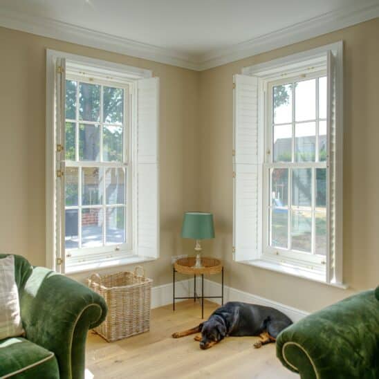 Bygone PVCu sash windows in white - slim glazing bars and meeting rail maximise your view and fill your home with light