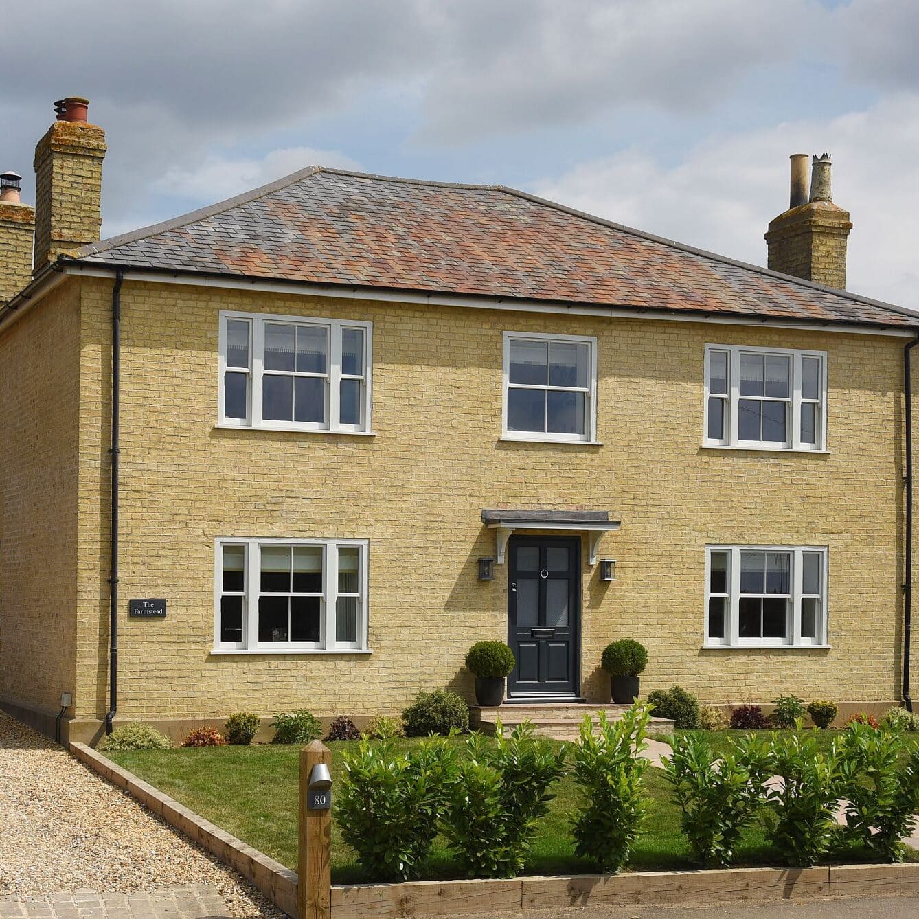 Smoke Cream Venetian hidden spring timber sash windows and Frenchay townhouse style door in Anthracite