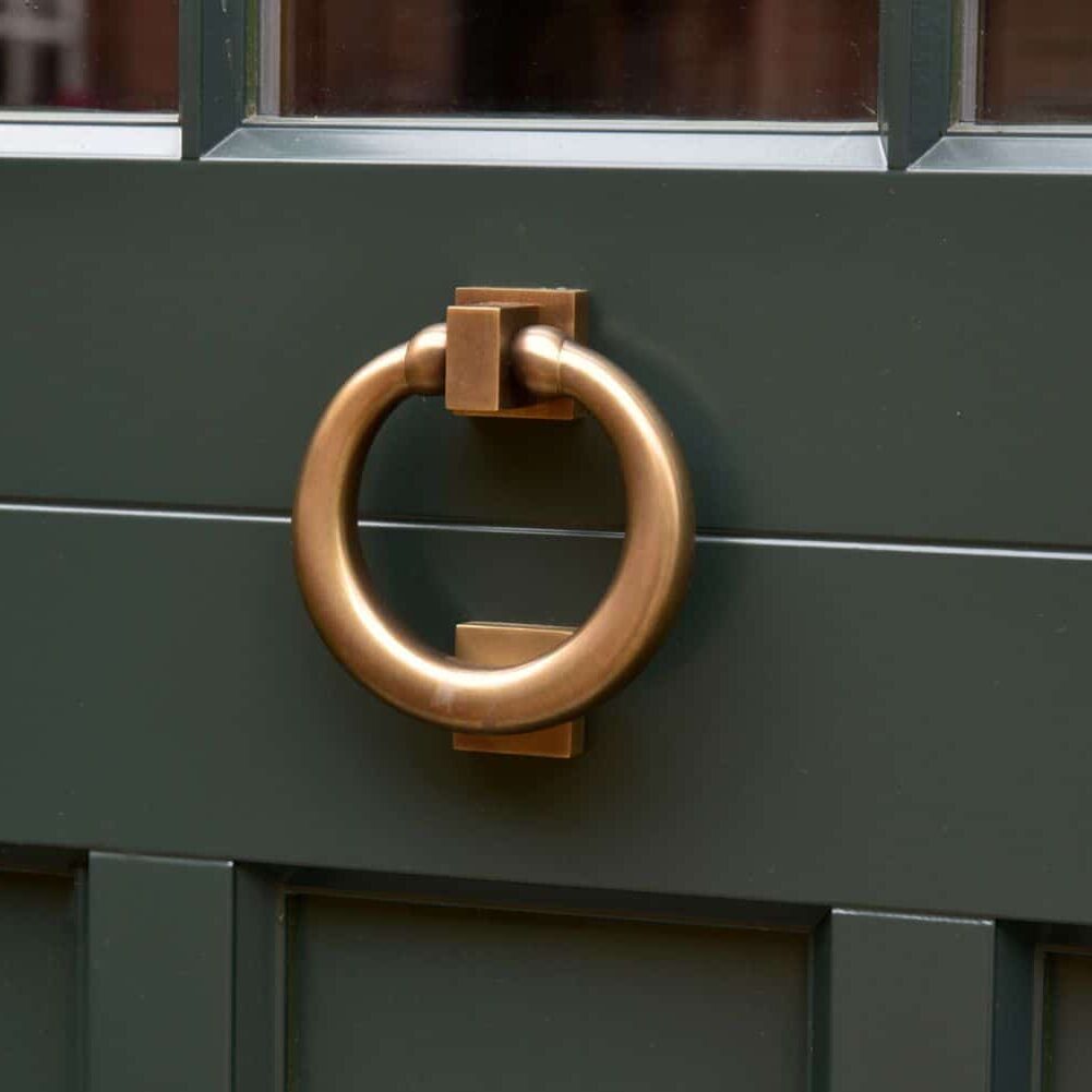 Antique brass unlacquered ring knocker by Samuel Heath