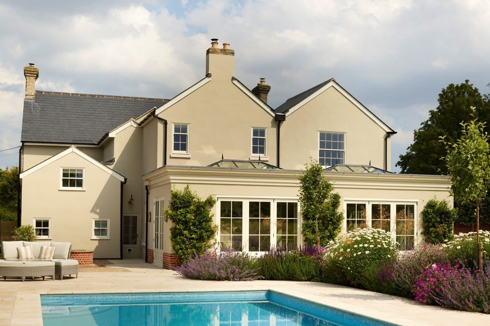 Slim timber sash windows and cottage casement windows in Farrow & Ball Slipper Satin.