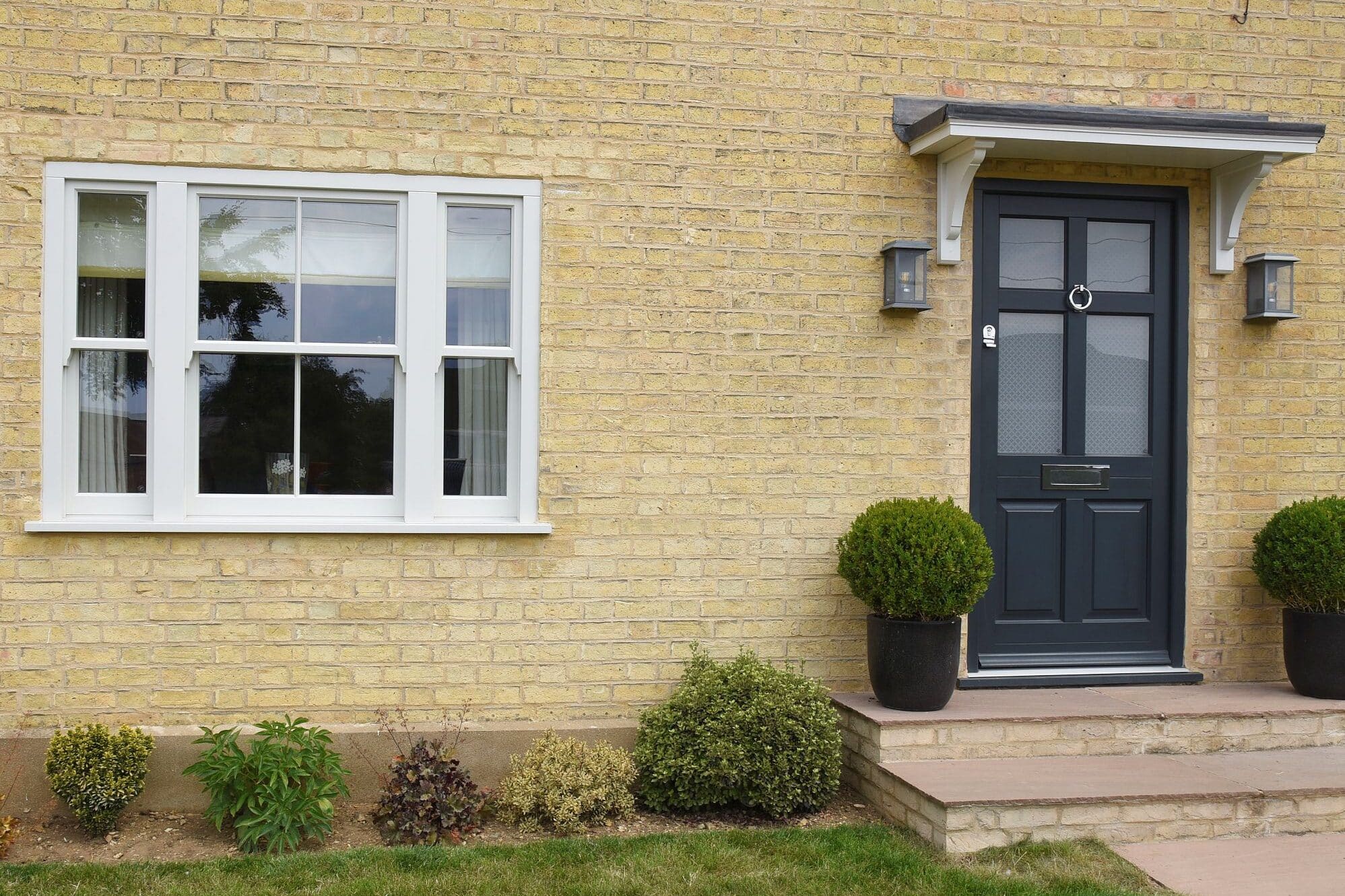 Smoke Cream Venetian hidden spring timber sash windows and Frenchay townhouse style door in Anthracite
