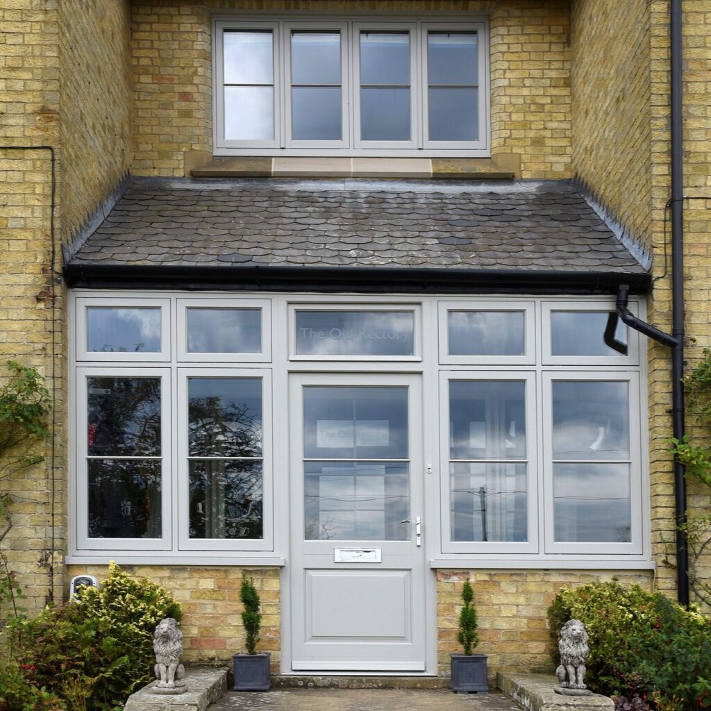 Timber flush casement windows and Bardwell entrance door in Porcelain for this former Rectory