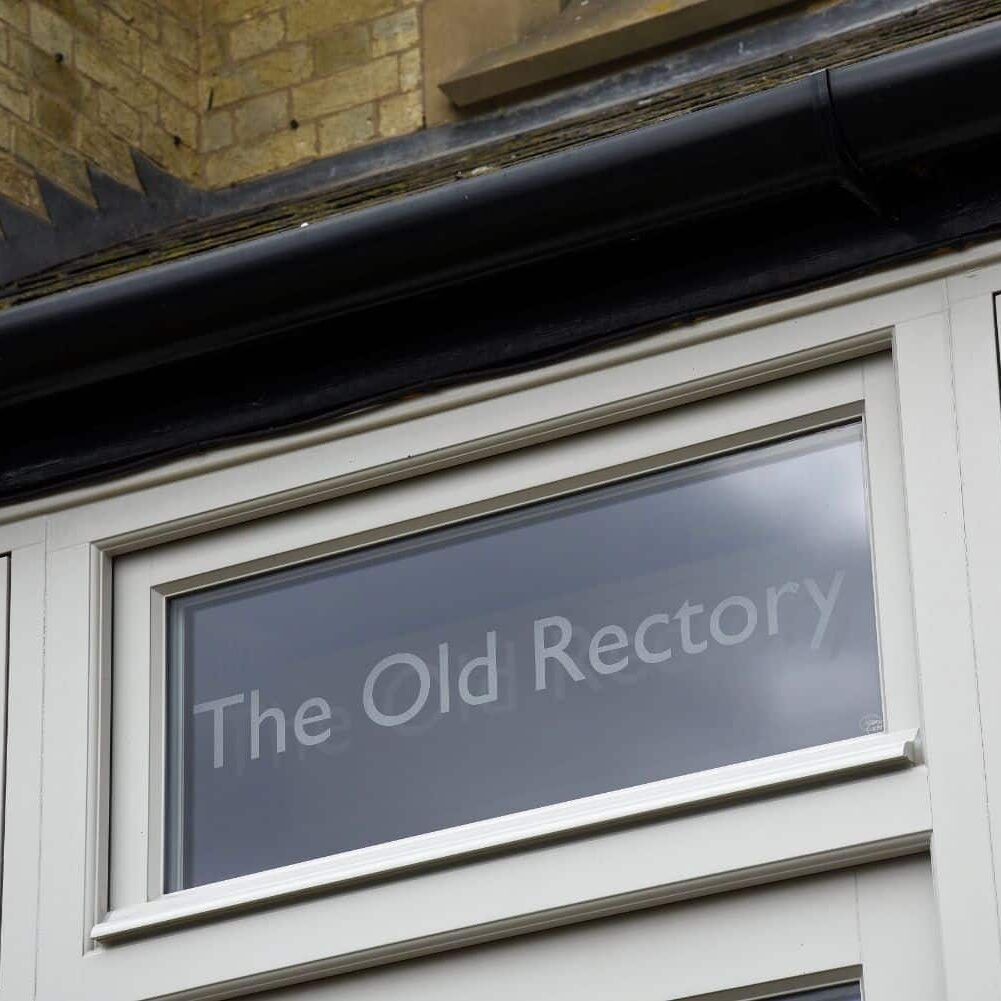 Timber Bardwell entrance door in Porcelain with sandblasted house name in the fanlight