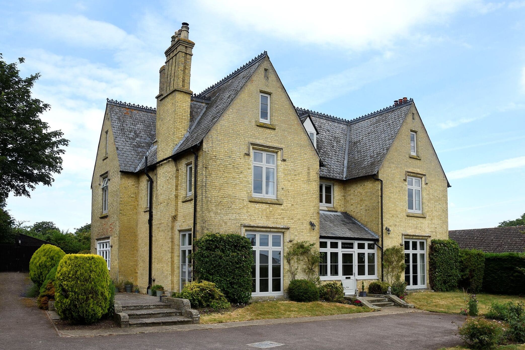 Timber flush casement windows and Bardwell entrance door in Porcelain for this former Rectory