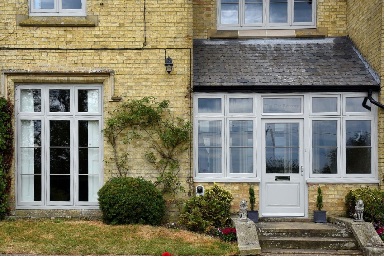 Timber flush casement windows and Bardwell entrance door in Porcelain for this former Rectory
